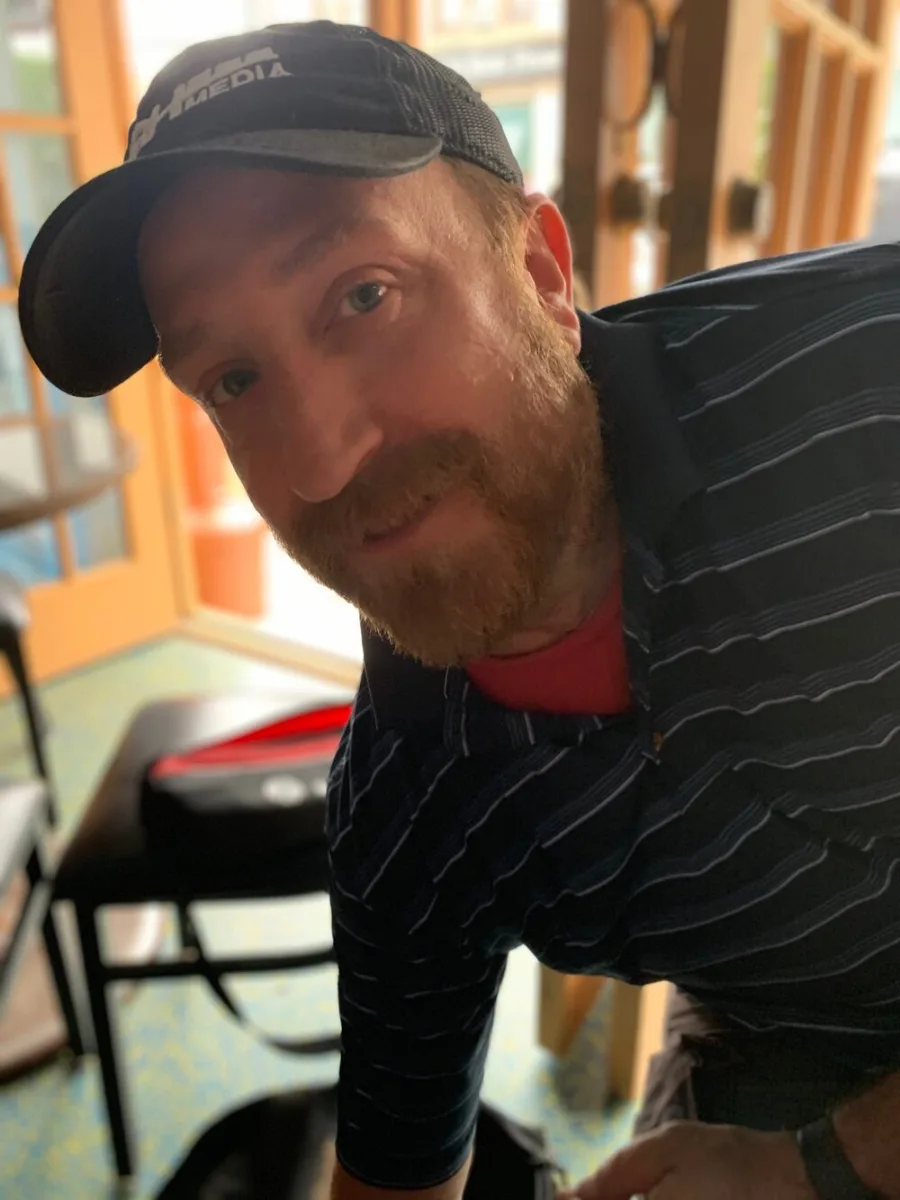 Kyle Hamman in a baseball cap, close up