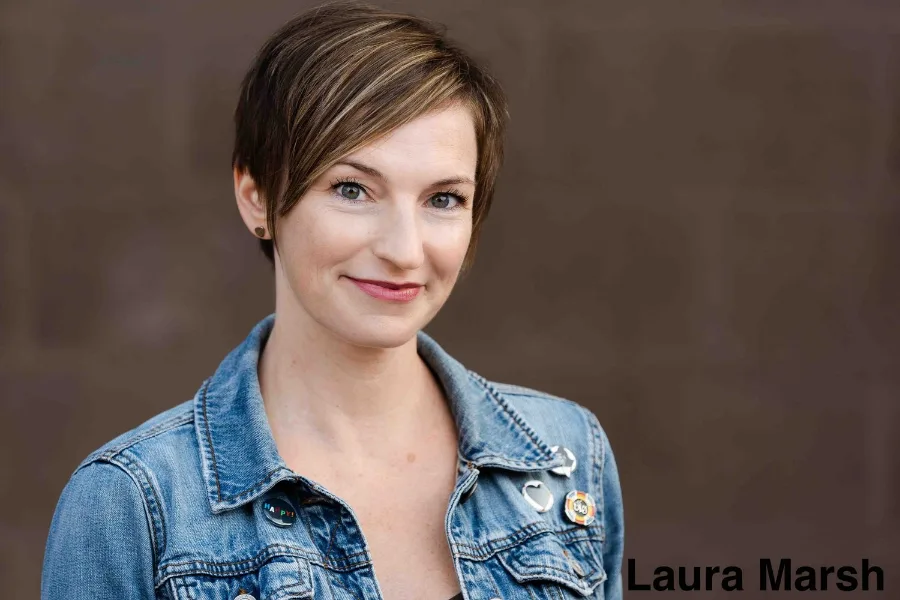 Laura Marsh in a denim jacket, smiling